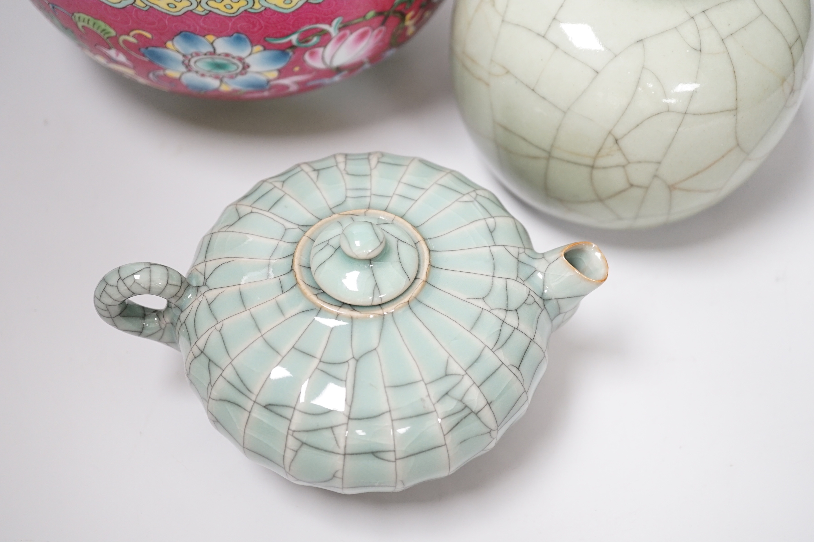 A Chinese enamelled bowl, a pair of celadon jars and a Chinese wine pot, tallest 12.5cm